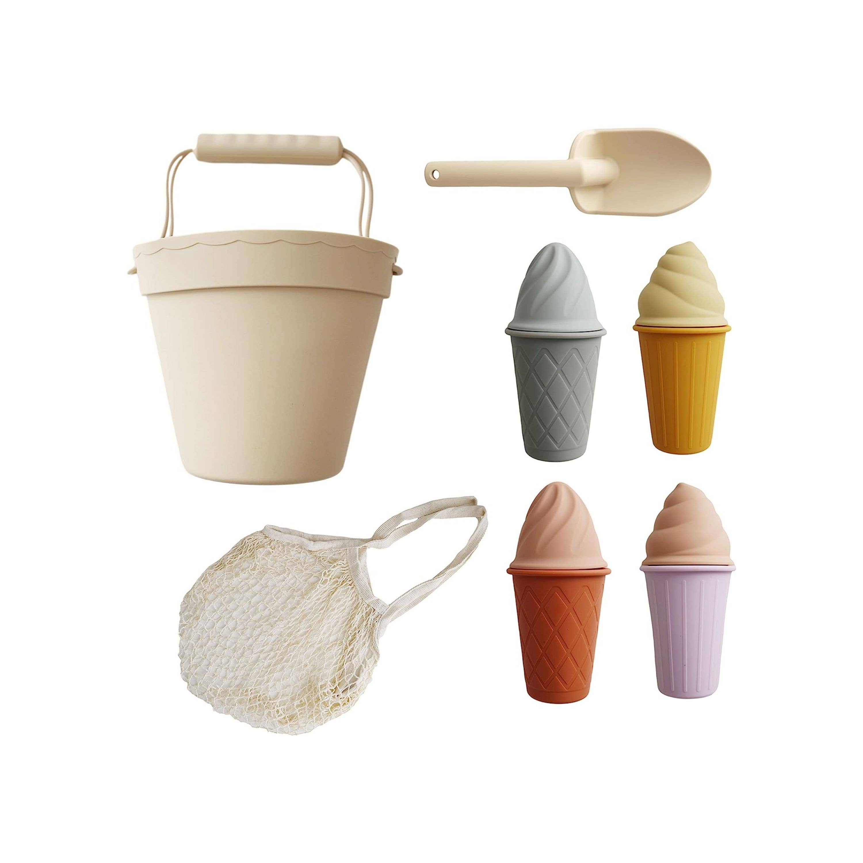 Retro-inspired silicone ice cream beach set with pastel-colored cones, ice cream tops, bucket, and shovel, all packed in a cotton storage bag for easy, on-the-go play.