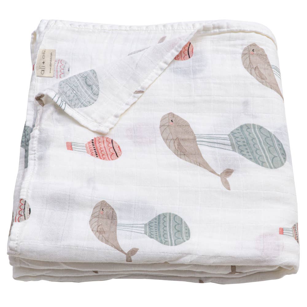 Folded fabric with whale pattern on a white background