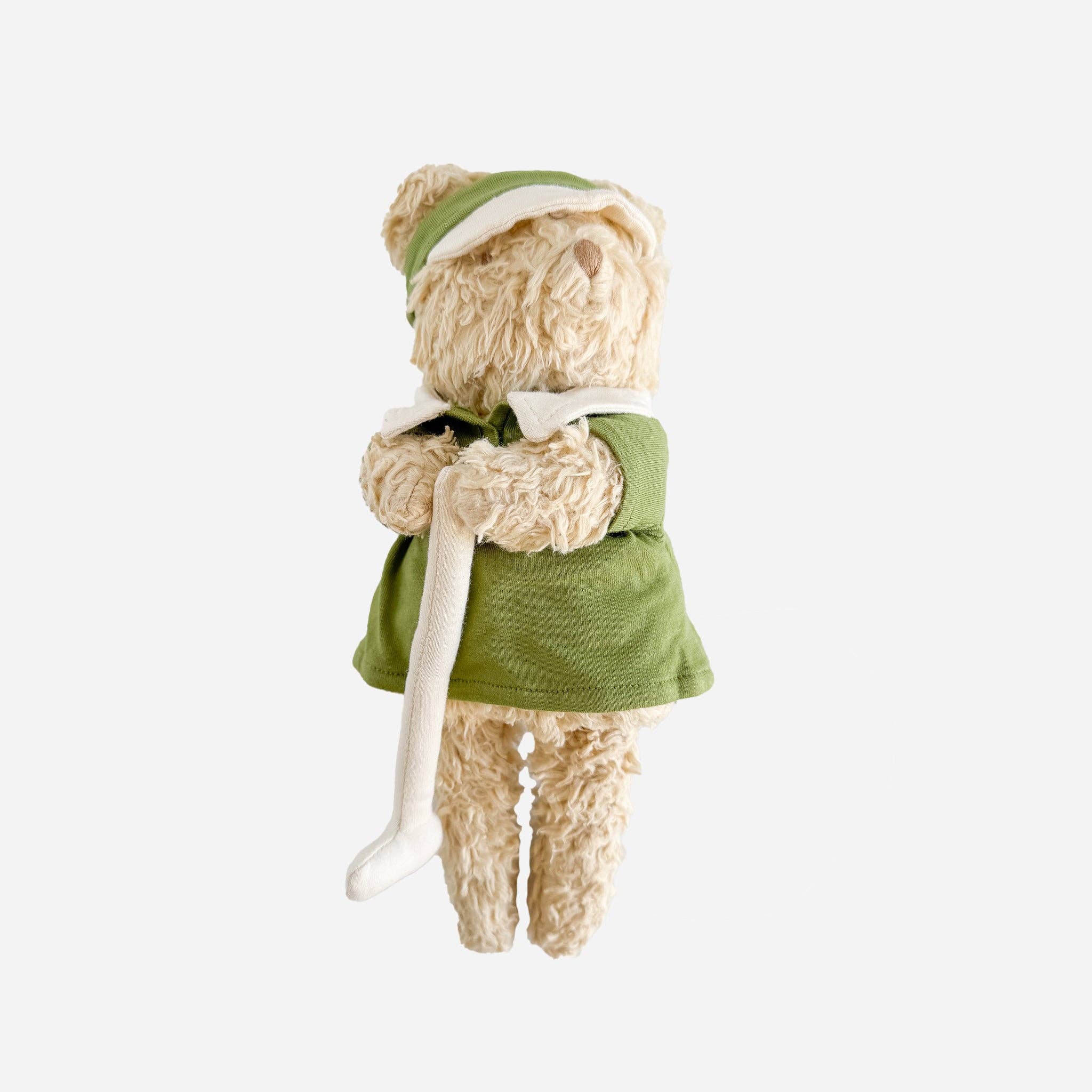Walter the Golf Bear plush toy wearing a visor and polo, holding a soft golf club, made from organic cotton by The Blueberry Hill