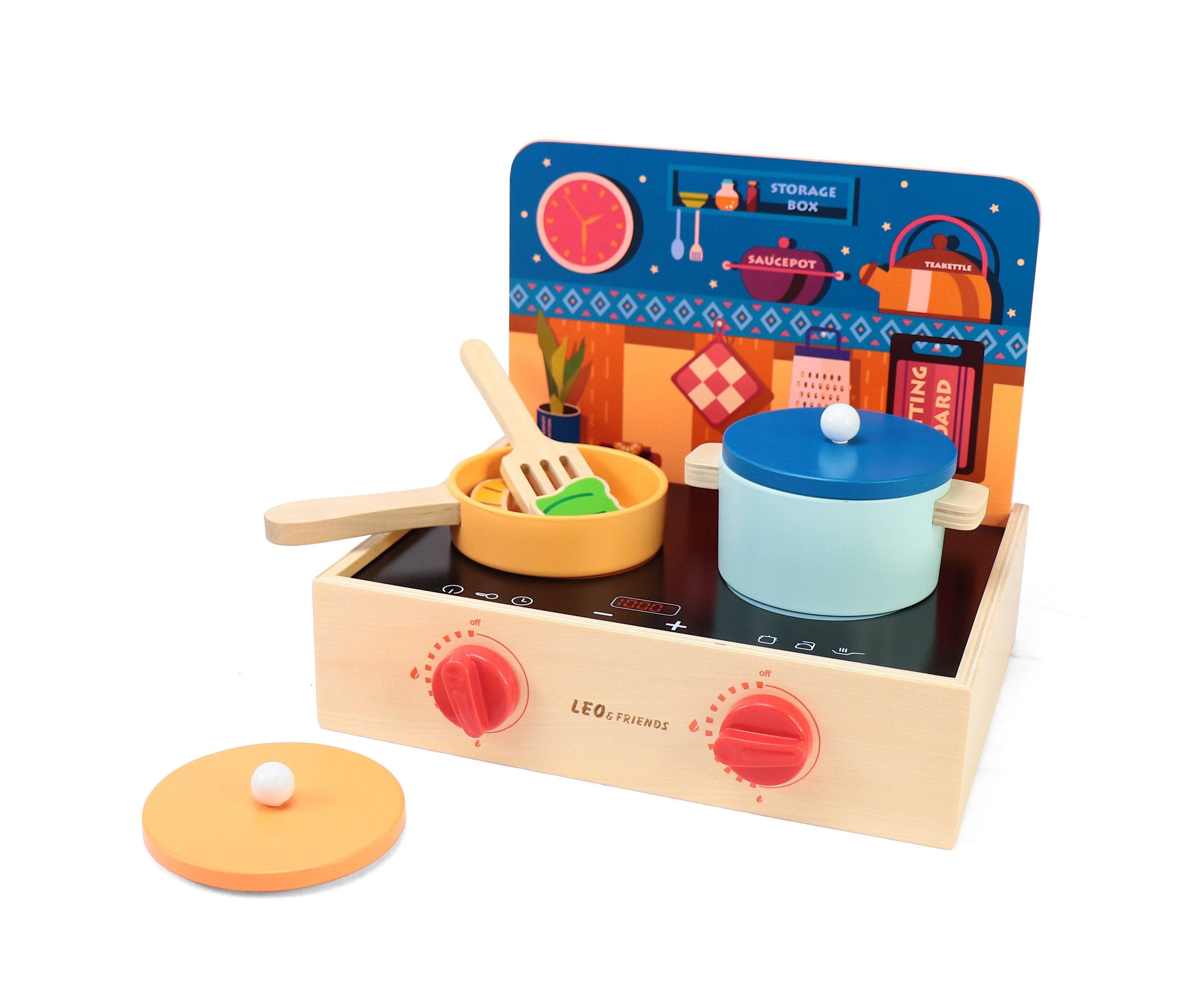 Mini wooden kitchen play set with 15 pieces, including a stovetop, cooking utensils, and wooden food items for pretend play; designed for toddler chefs ages 3 and up.